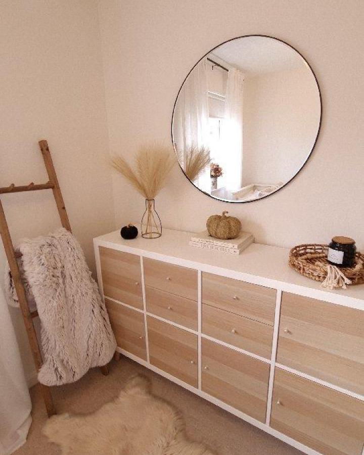 Light wood drawer fronts Ikea Kallax styling ideas from @blackbeardswife with neutral pampas grass and cozy textiles.