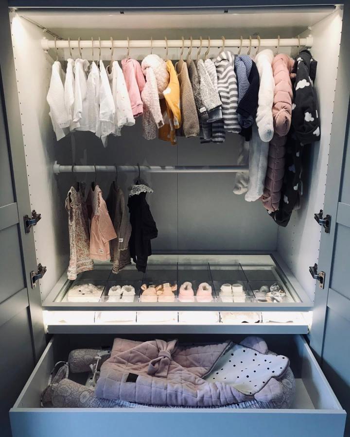 soft pastel kids wardrobe with double hanging rods and shoe organizer from @dziudaida neat ikea kids wardrobe ideas with clear drawers and cozy clothes