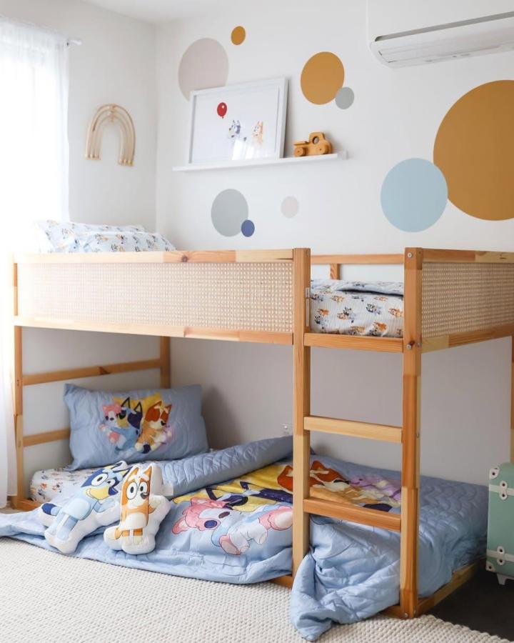 Light natural wood ikea kura bed ideas for small rooms by @tegan_jean with playful bedding and woven side panels in cozy kids room