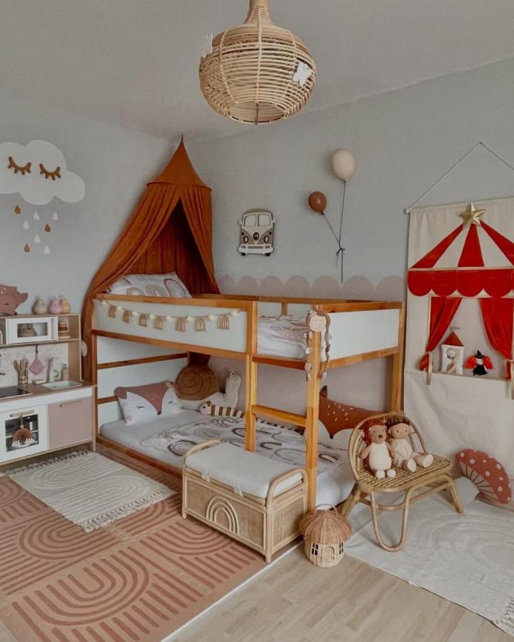 Warm wood and cream Ikea kura bed ideas for small rooms from @my.sweet.lil.three featuring cozy canopy and wicker accents.