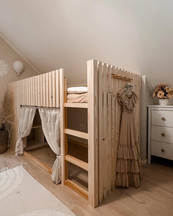 Natural pine slatted ikea kura bed ideas for small rooms with cozy curtain nook and wooden ladder by @neppaho