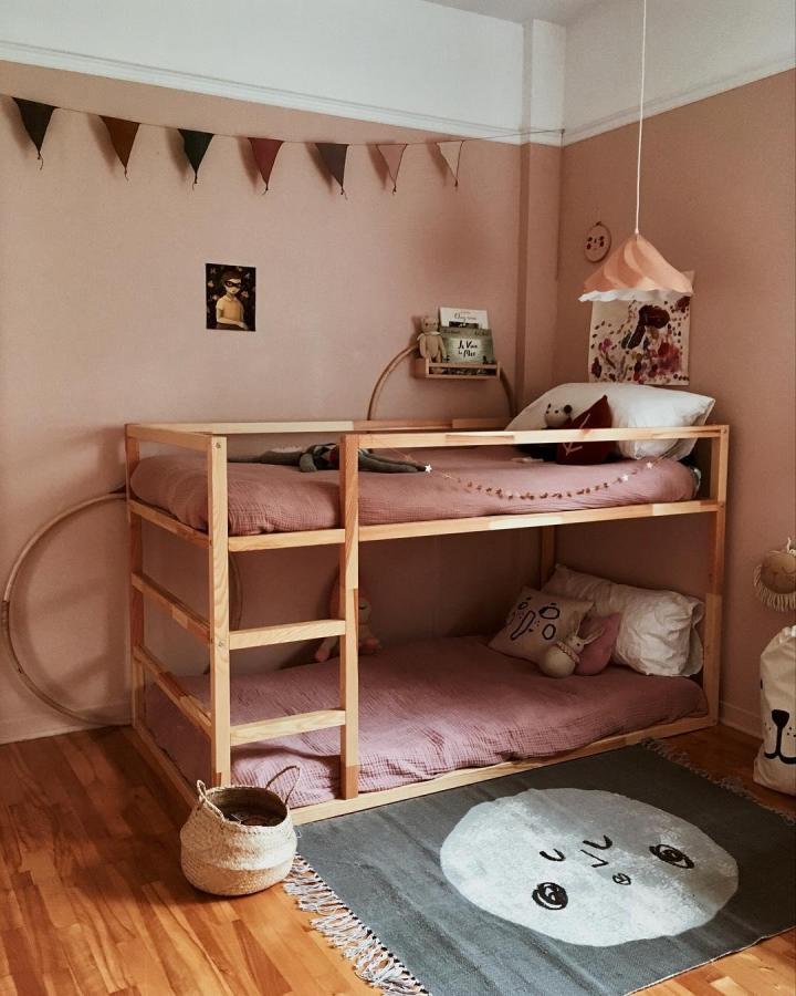 natural pine ikea kura bed ideas for small rooms bunk bed with mauve bedding and cozy rug from @petiteslunes small kids room design