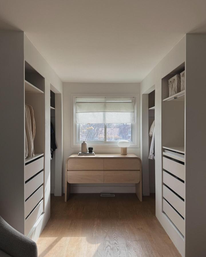 Warm wood tones built-in drawer storage in minimalist walk-in closet from @wonhaus ikea pax hacks for walk-in closets with soft natural light