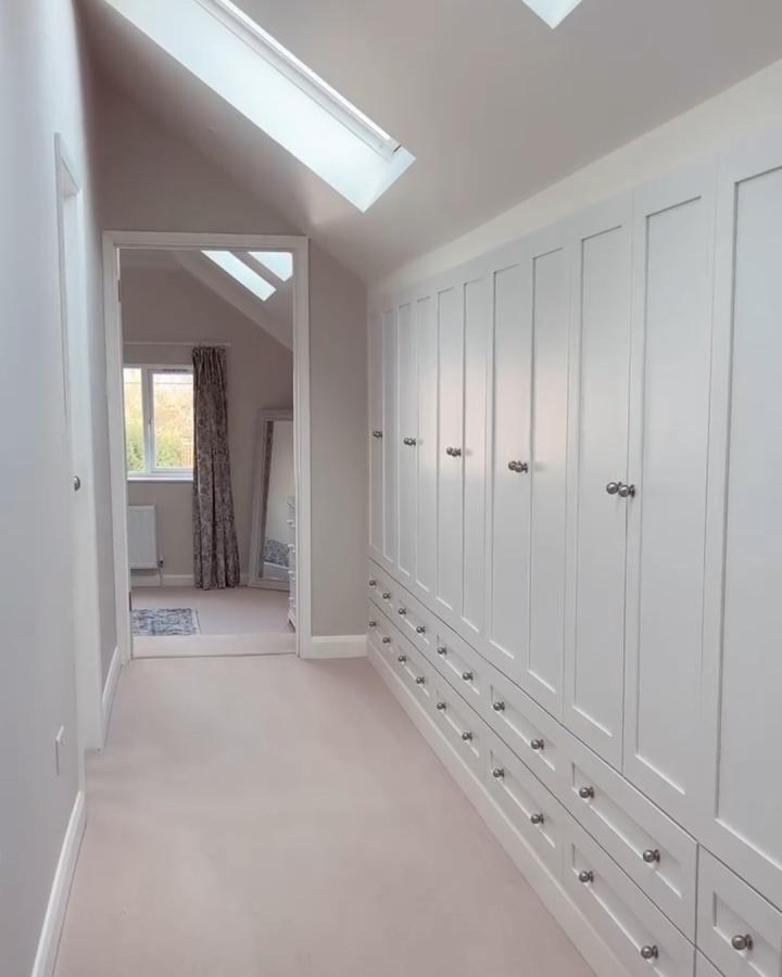 White shaker-style built-in storage with drawers in a narrow hallway from @latteandlullabies showing ikea platsa hacks for awkward alcoves.