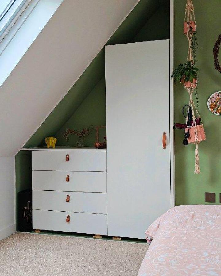 White Ikea Platsa storage with leather handles under sloped ceiling in cozy bedroom from @fields_of_architecture ikea platsa hacks for small bedrooms.