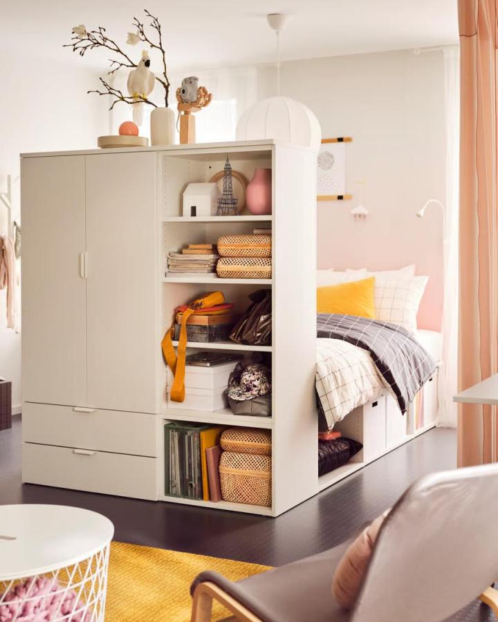 White and beige Ikea Platsa storage units transformed into bed frame and shelves in a small bedroom by @designbycilla.