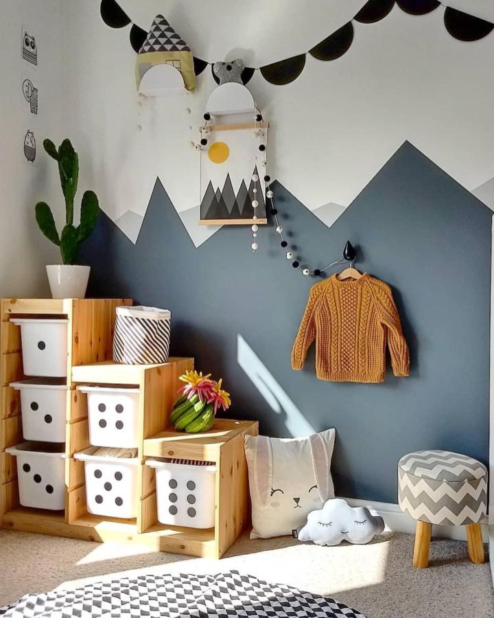 Natural pine wooden steps with white Ikea Trofast bins in a cozy playroom corner from @little_york_house. Simple, stylish ikea trofast playroom ideas.