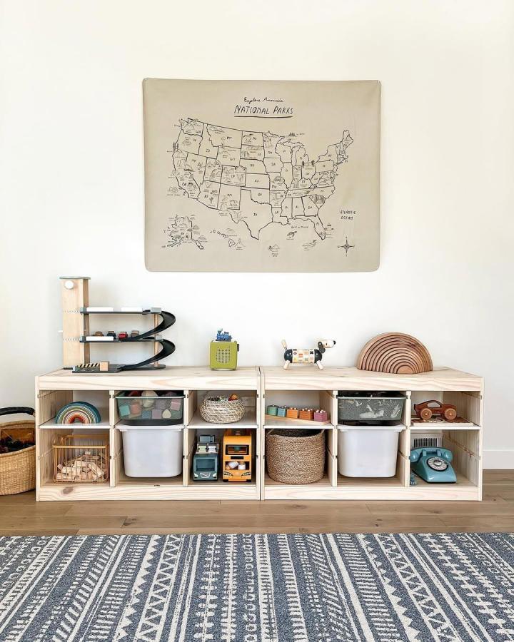 Natural pine wood ikea trofast playroom ideas storage bench with baskets and toys from @jessspartyof5 in a bright, cozy space