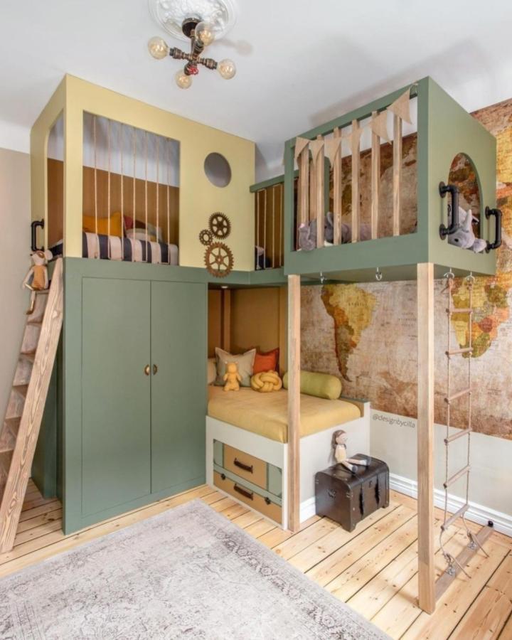 Olive green and mustard yellow multi-level bedroom furniture with rope ladder and storage from @playful_rooms ikea platsa wardrobe hacks playful kid’s area.