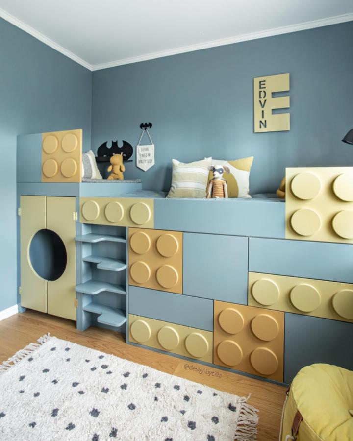 Lego-inspired yellow and blue ikea platsa wardrobe hacks in playful kids room with built-in shelves and seating from @designbycilla.