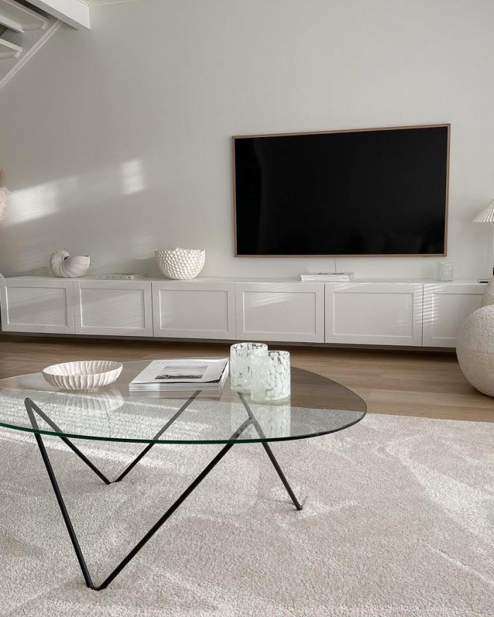 White paneled floating TV unit with matte finish in a modern living room from @byhennakoo. Clean lines and minimalist style ikea besta floating tv unit ideas.