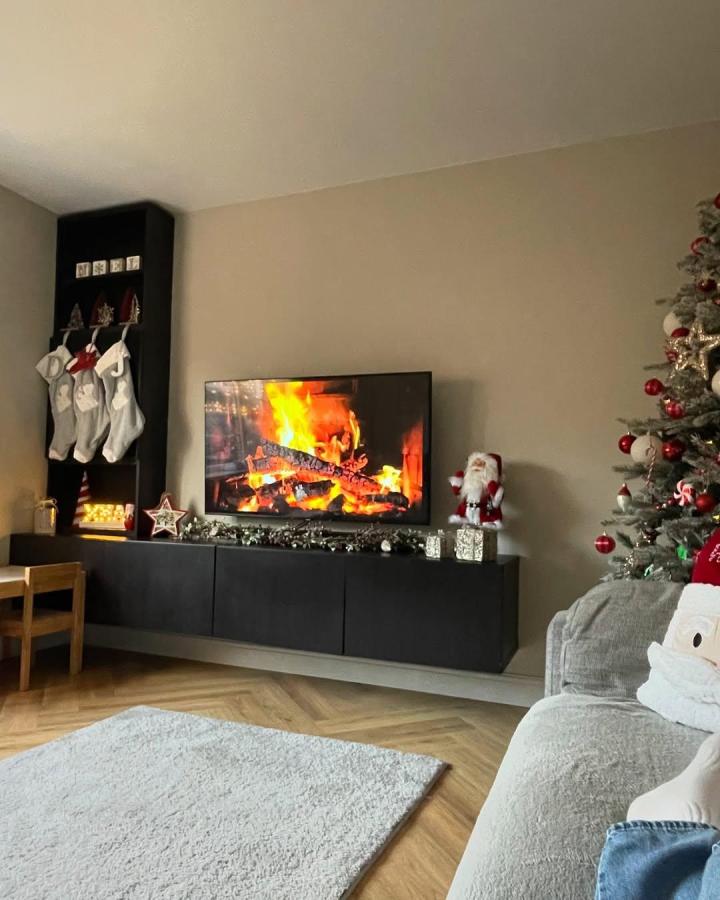 black matte Ikea Besta floating TV unit ideas from @ashken_x_home with festive decorations and floating design in living room space