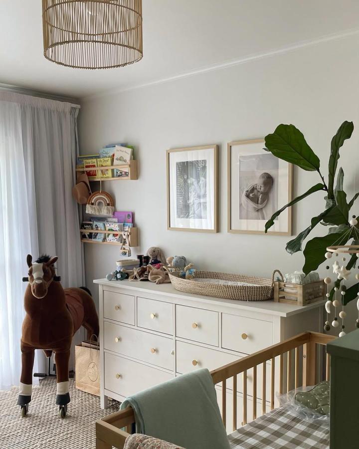white Ikea Hemnes dresser with woven baskets and rattan changing tray in a cozy nursery by @this_little_farmstead ikea hemnes nursery ideas