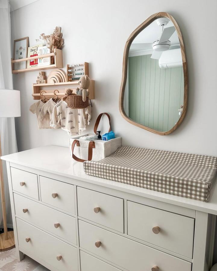 light wood and white Ikea hemnes nursery ideas dresser with gingham changing pad and natural decor from @homestylebytess creating a warm, serene space