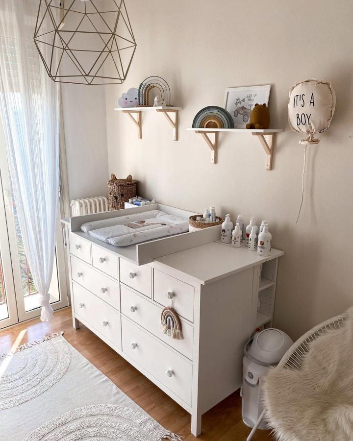 White Hemnes dresser nursery setup from @nicoleturri with soft decor and shelves ikea hemnes nursery ideas bright and cozy space.