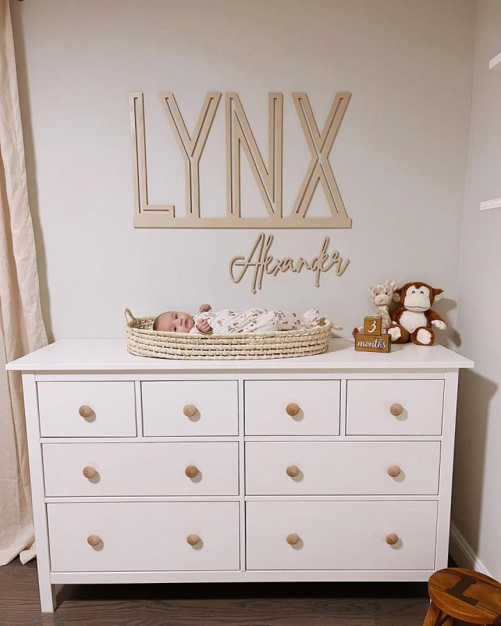 White nursery dresser with natural wood knobs and 15 drawers by @dianasaldanahome. Minimal vintage-inspired design with cozy accents.