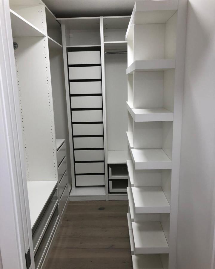 white minimalistic walk-in closet with ikea pax and lack shelves by @mixkitchendesign practical and airy ikea pax dressing room ideas