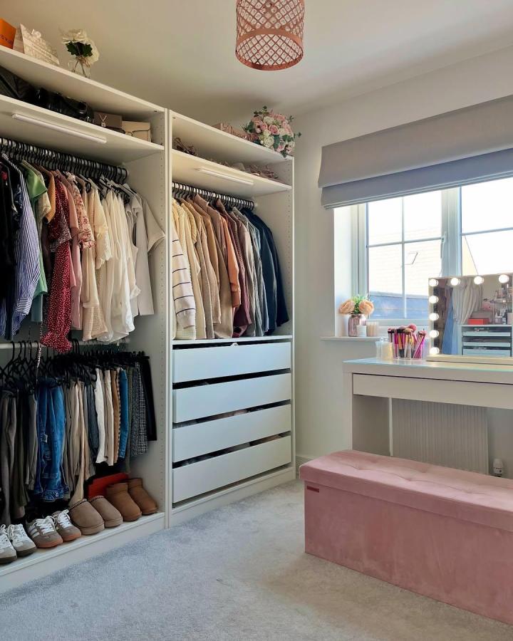 soft pink velvet bench and white ikea pax dressing room ideas by @heavenatnumber7 with organized clothes and natural light