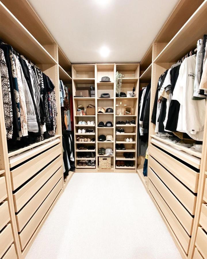 light wood ikea pax dressing room ideas walk-in closet with open shelving and drawers by @samb0s bright and tidy space with natural wood finish