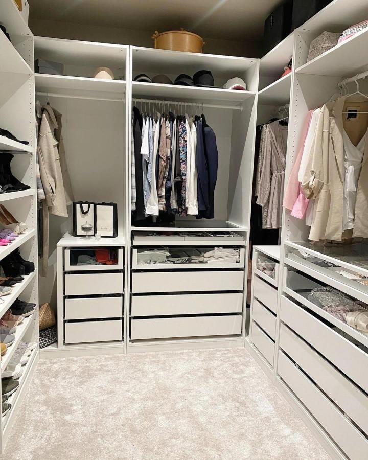 white Ikea Pax dressing room with glass front drawers by @ma.bungalow showcases clean, modern ikea pax dressing room ideas and clever storage.