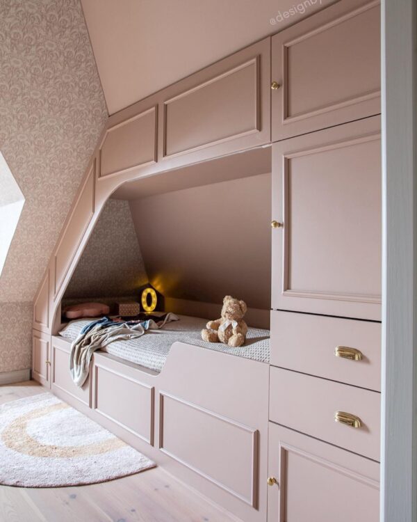 Blush built-in kids room from @designbycilla. IKEA Platsa storage creates a cozy attic bed nook.