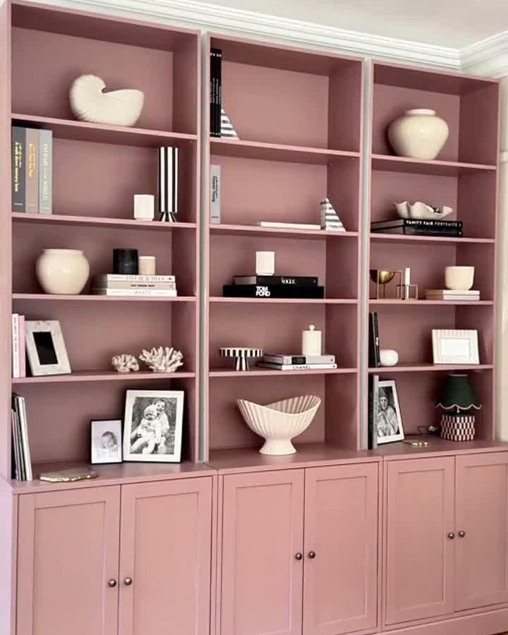 Blush pink Billy bookcase built ins ideas from @bellasdragonden featuring ceramic vases and stylish closed cabinetry.