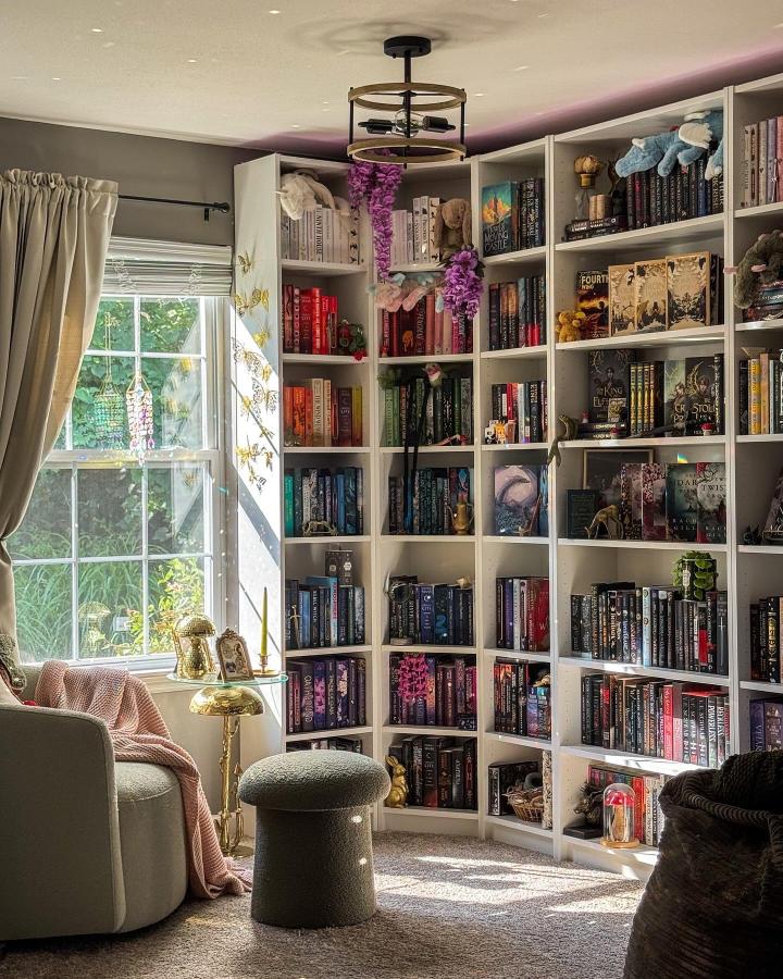 Brightly Color-Coded Ikea Billy Corner Bookshelves From @fantasyandfoliage Filled With Books And Decorative Accents In A Cozy Room