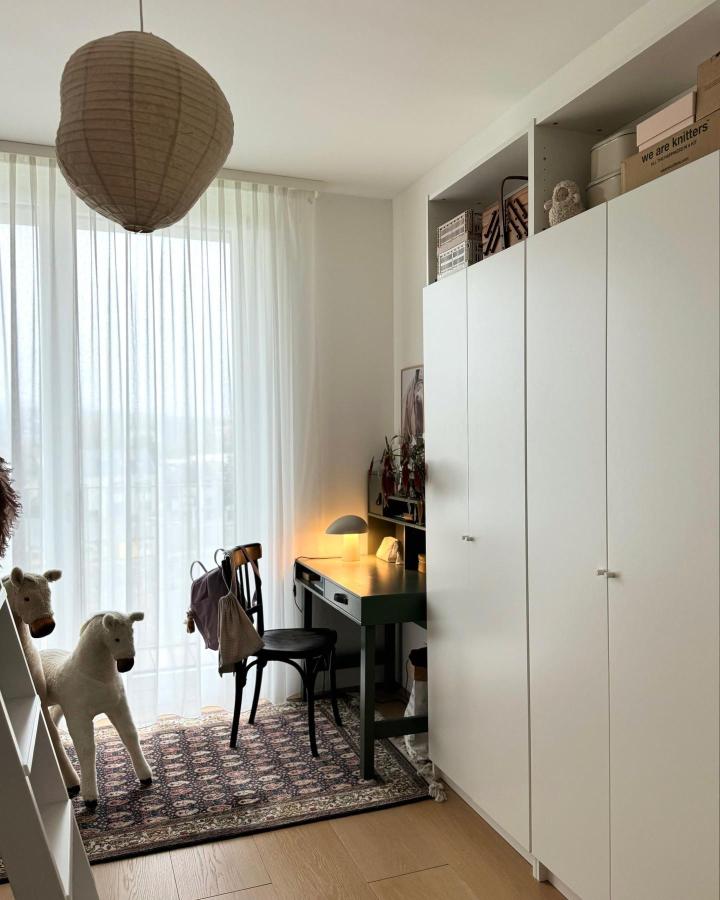 White minimalist Ikea Billy cabinets in a kids room from @anno_living with shelving and soft natural light ikea billy kids room ideas.