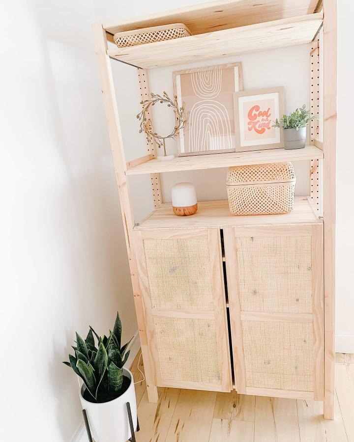 Light wood and rattan woven cabinet doors with natural decor by @abeautifulmess showcasing a cozy storage upgrade.