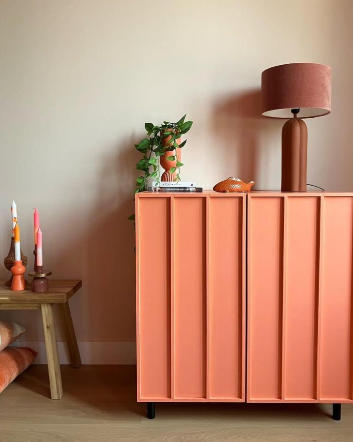Coral wide-gap fluted panel cabinet with black legs and decorative items from @stylelon showcasing a unique Ivar door transformation.