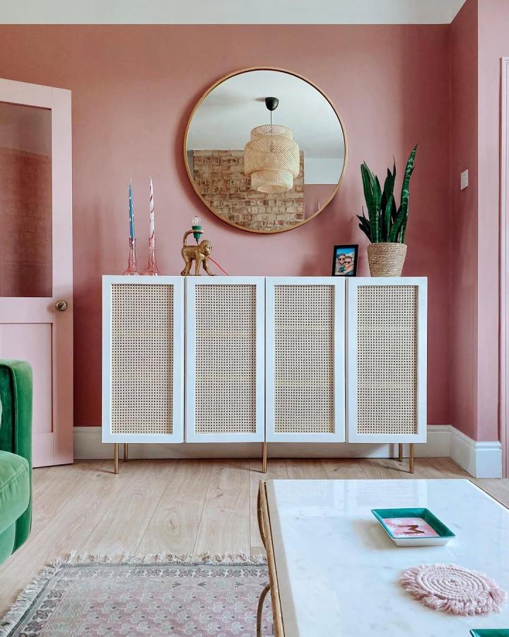 White painted IVAR cabinet doors with cane webbing and brass legs in a stylish living room by @megmonde. Fresh woven texture and soft color contrast.