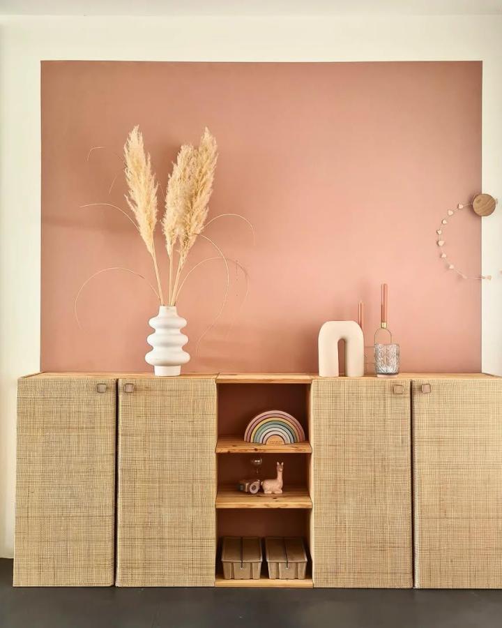 Natural cane webbing Ikea ivar door hacks from @house_of_pancakes with warm blush background and minimal styling.