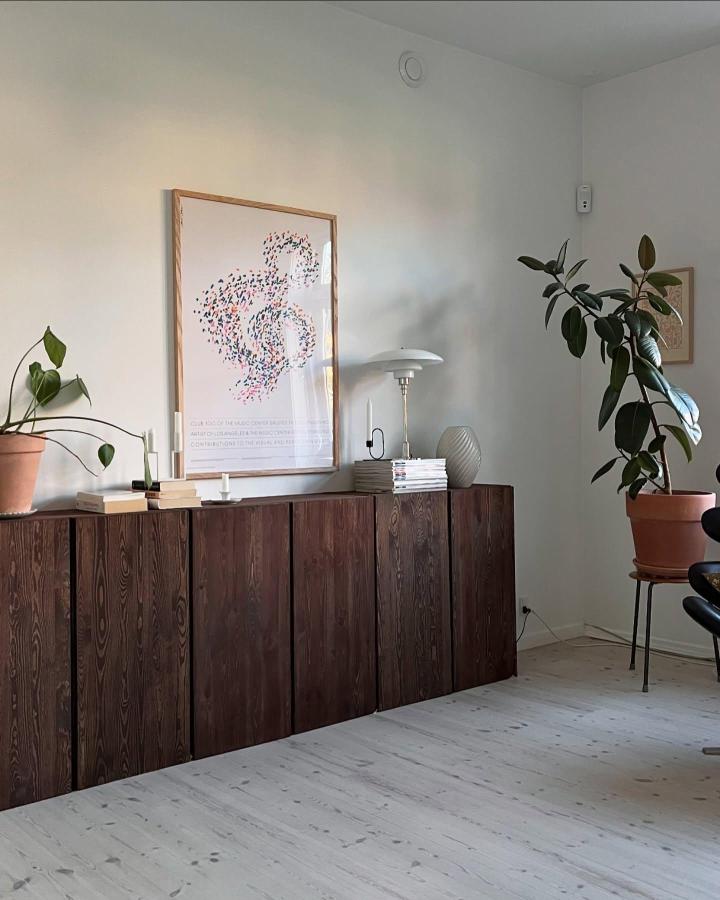 Dark wood finished Ikea ivar cabinet by @idenhvidevilla showcasing natural grain and sleek minimalist design ikea ivar makeover ideas.