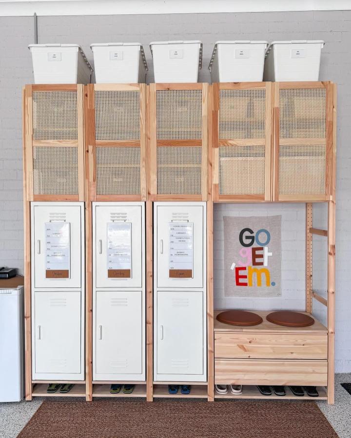 Natural pine and cane mesh storage with metal lockers and bench nook from @househomelove showcasing a stylish home entryway remodel.