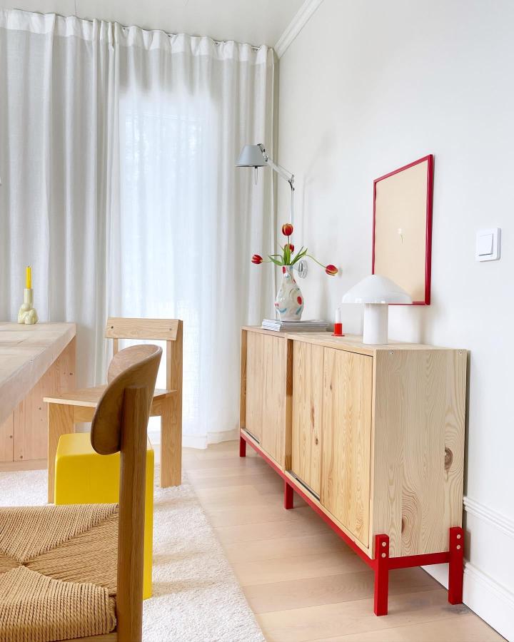 Natural pinewood Ikea Ivar cabinet with bold red metal base from @tegelsnackan showcasing fresh ikea ivar makeover ideas in a bright living room.
