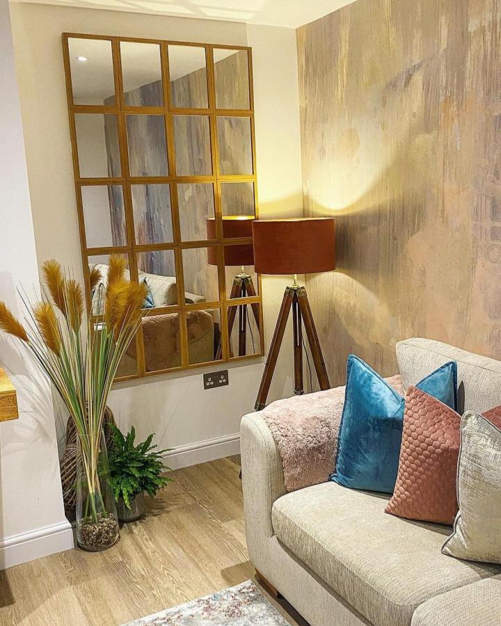 Wood framed grid mirror in cozy living room setup from @my_style_our_home with warm lighting and natural decor accents.