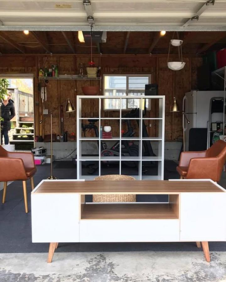 White Ikea BILLY bookcase garage divider from @whyhello.blythe brightens and organizes with stylish storage and open shelving.