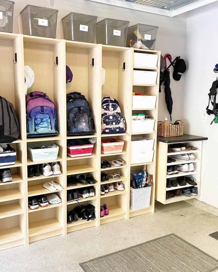 Natural wood mudroom lockers from @sortedbliss with clear bins and shoe racks showcasing ikea mudroom lockers hacks for organized storage.