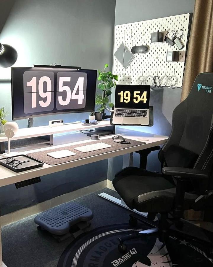 White pegboard mounted above desk by @idyeology for compact tech storage and tidy workspace organization.