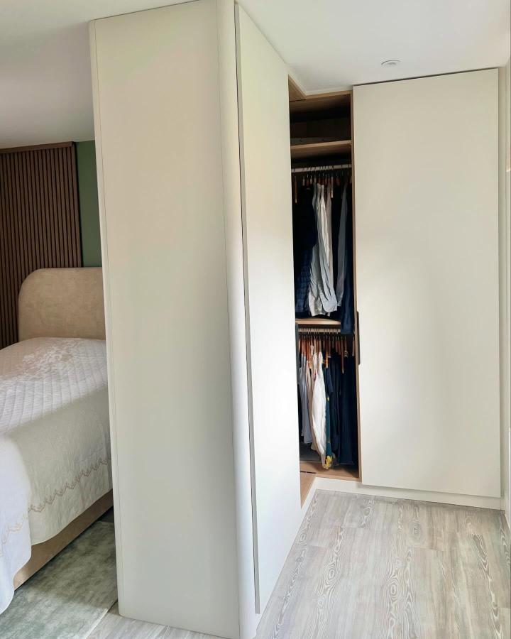 White matte finish bedroom wardrobe from @the_pax_man with corner storage and double hanging rods maximizing space.