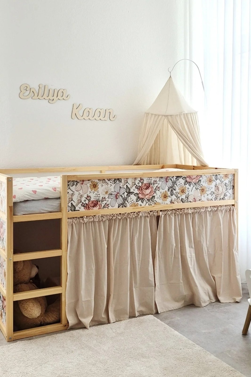 best accessories for ikea kura beds featuring a floral canopy, gathered bed skirt, and pine frame