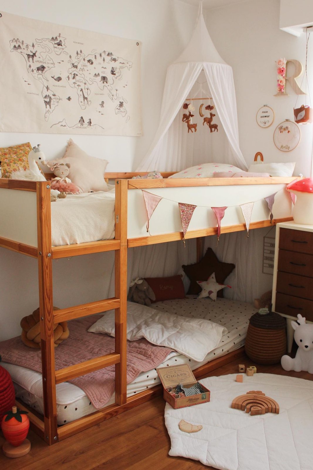 Soft canopy and bunting accessories styling a cozy Ikea KURA bunk bed
