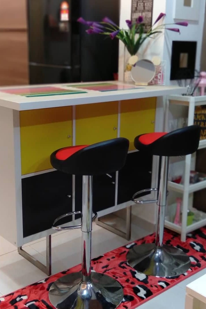 Colorful IKEA KALLAX room divider with countertop separating kitchen and living area