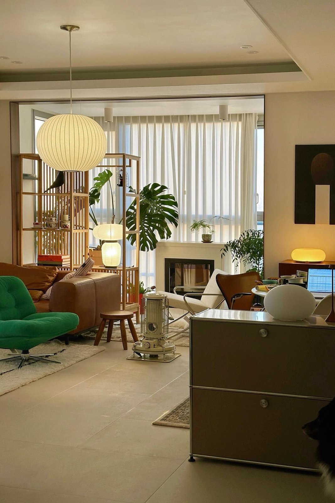 IKEA NORDKISA open shelving divider zones a bright living room while preserving light