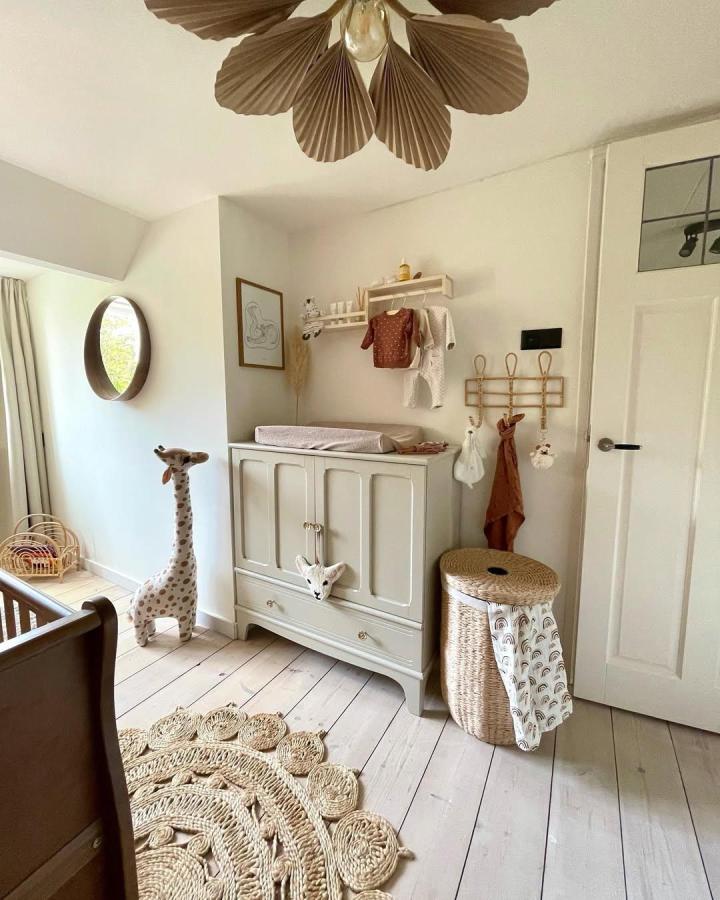 Beige painted Ikea Bekvam cabinet nursery corner by @lobiandstyle with woven basket and natural texture accents. Cozy and organized baby space.