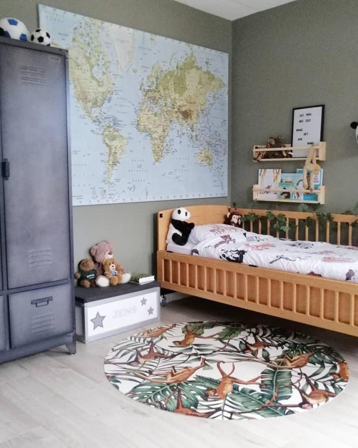 Natural wood bench and shelf with green walls in a nursery from @wendy.family.newhome showcasing ikea bekvam nursery ideas with playful storage and decor.