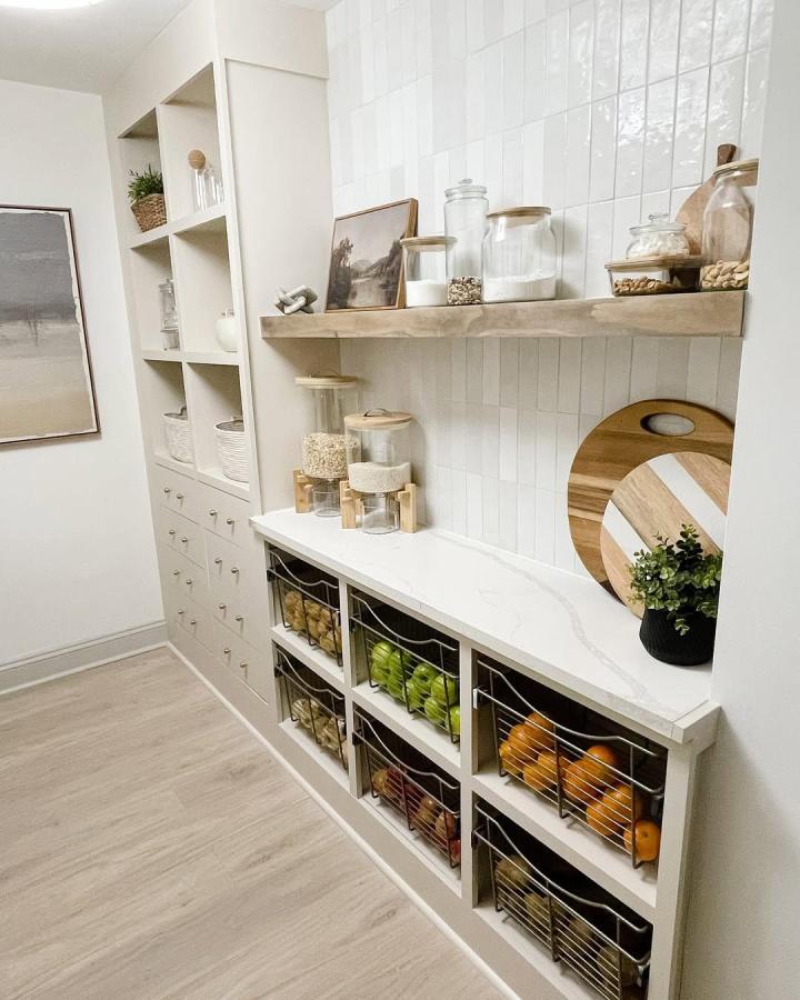 White built-in pantry with wire baskets and wood shelf by @elizabeth_deister showing creative ikea billy pantry ideas for stylish storage organization.