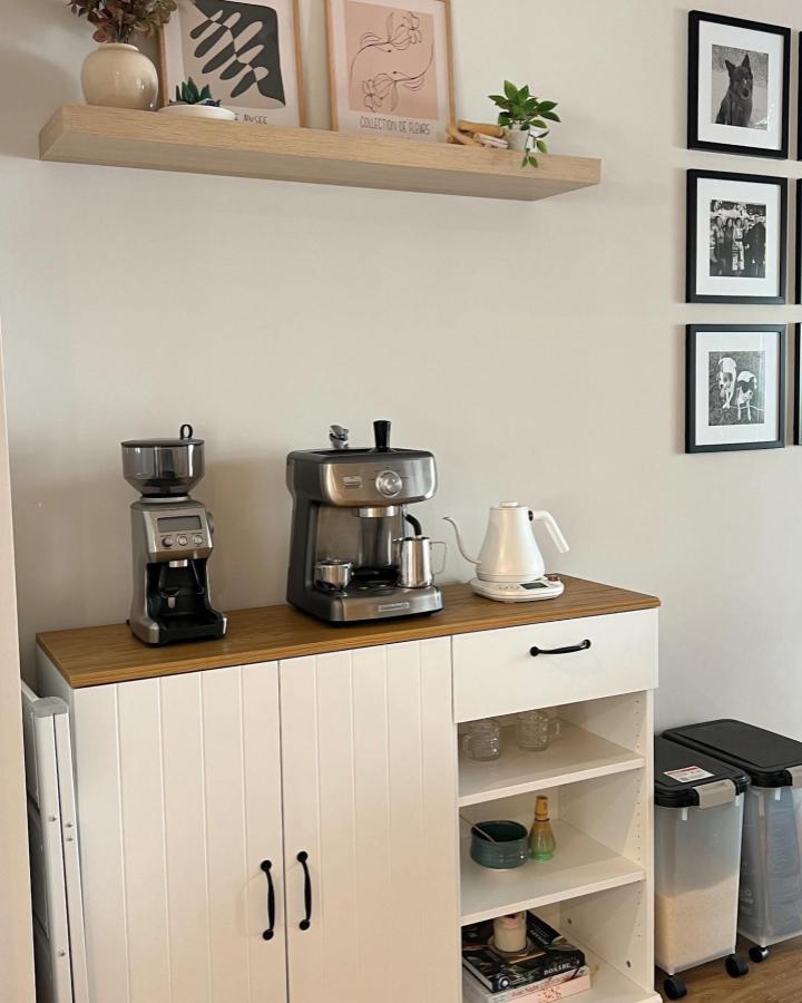 White SKRUVBY cabinet coffee nook from @aurelietutu with wood top and sleek appliances in cozy kitchen corner.