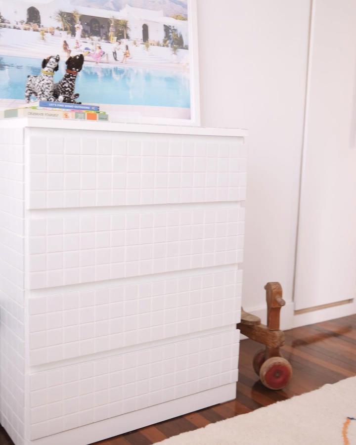 White tiled Ikea Malm dresser from @geebungalow with modern textured surface perfect for ikea malm nursery ideas changing table.