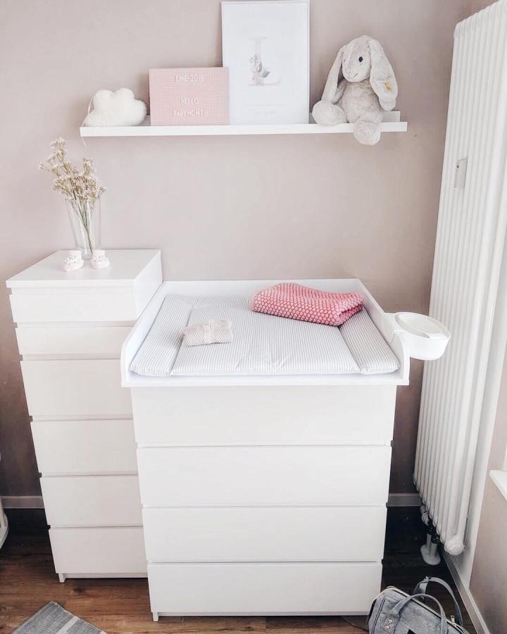 White minimalist Ikea Malm dresser nursery setup from @newswedishdesign featuring a changing table element and soft pastel accents in ikea malm nursery ideas.